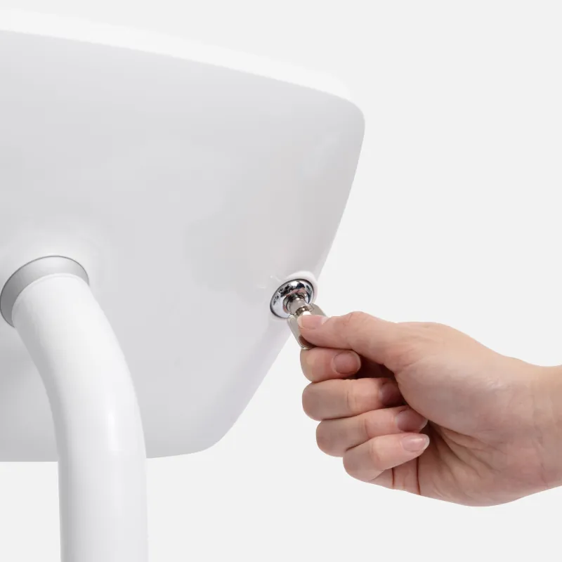 A hand turning a key in the lock on the back of a Bouncepad enclosure