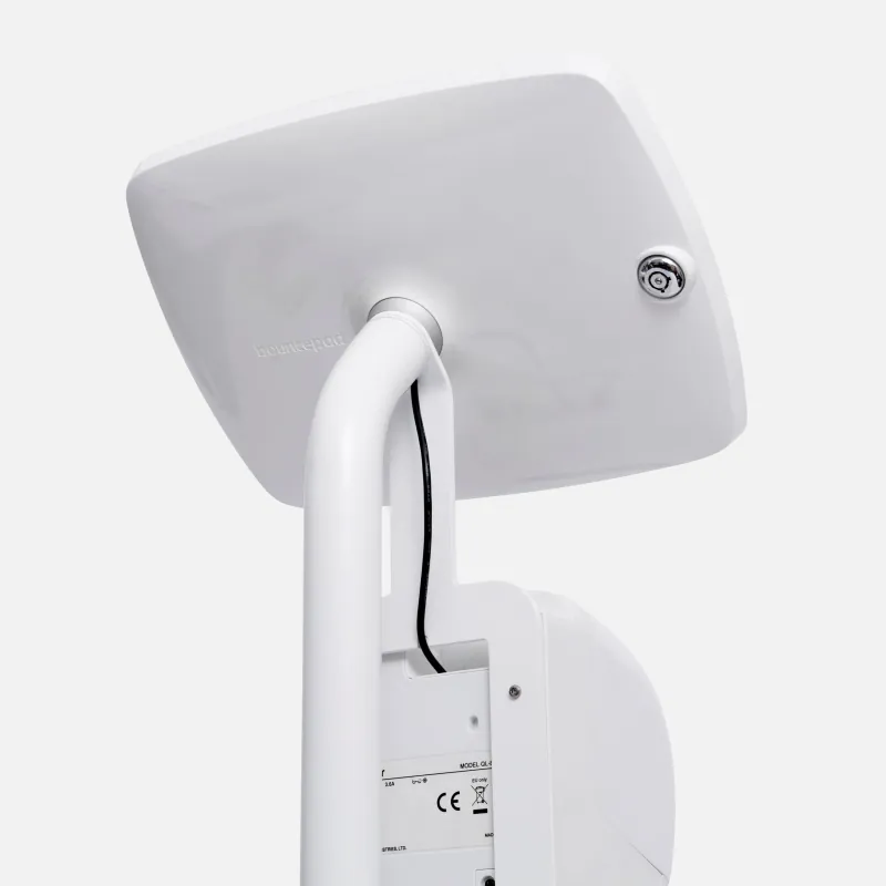 The back of a Bouncepad enclosure showing the charging cable routed into the post